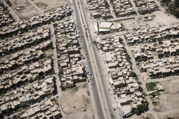 The streets and houses of Iraqi capital Baghdad are seen in this aerial picture taken from the helicopter transporting U.S. Secretary of State John Kerry